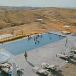 Swimming pool at The White Camel during an Agafay Desert day trip in Morocco