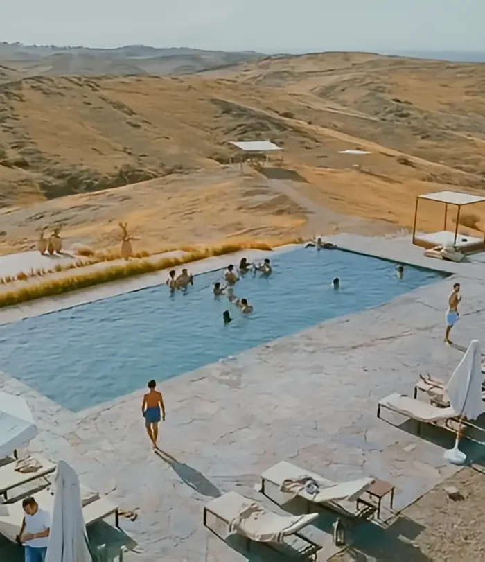 Swimming pool at The White Camel during an Agafay Desert day trip in Morocco