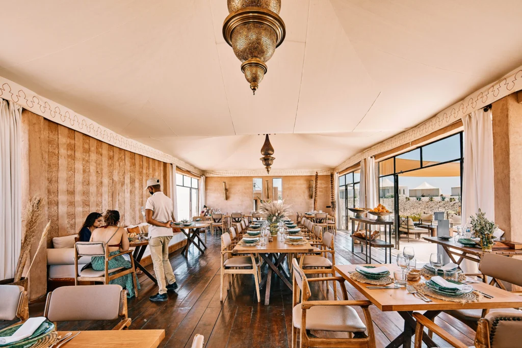 Dining setup at Singita Restaurant in The White Camel agafay luxury camp
